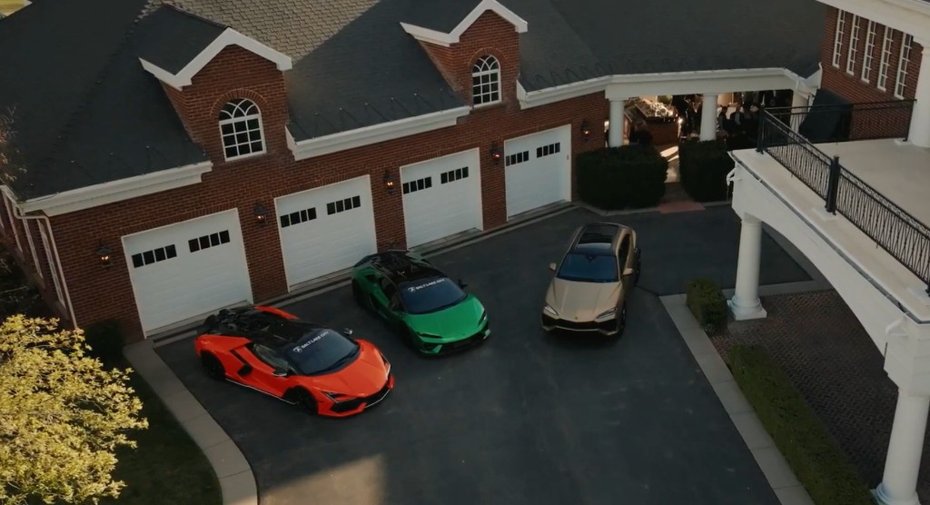 Aerial of orange, green, and gold Lamborghinis in a brick mansion driveway